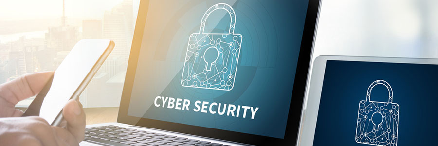 Cybersecurity on a computer screen while a business man is on his phone